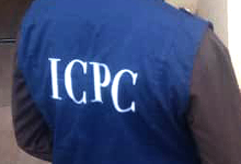 Person wearing a blue vest with ICPC on the back.