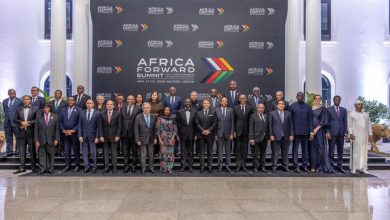 Group of dignitaries in formal attire posing on a stage in front of an Africa Forward Summit backdrop, Nairobi, Kenya (May 11–12, 2026).