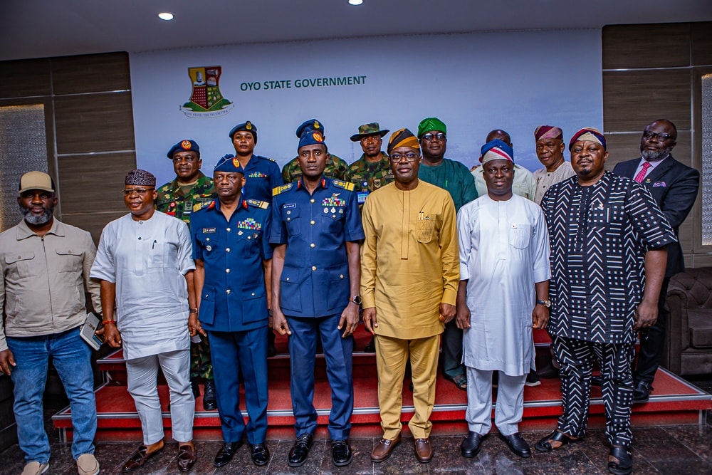 Makinde and NAF officers 4 - The Times of Abuja Group portrait of Nigerian officials and military officers standing on steps in front of a banner that reads 'Oyo State Government'.