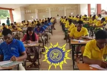 Students in yellow uniforms sit at desks taking an exam in a large classroom; a WAEC logo is visible in the center foreground.