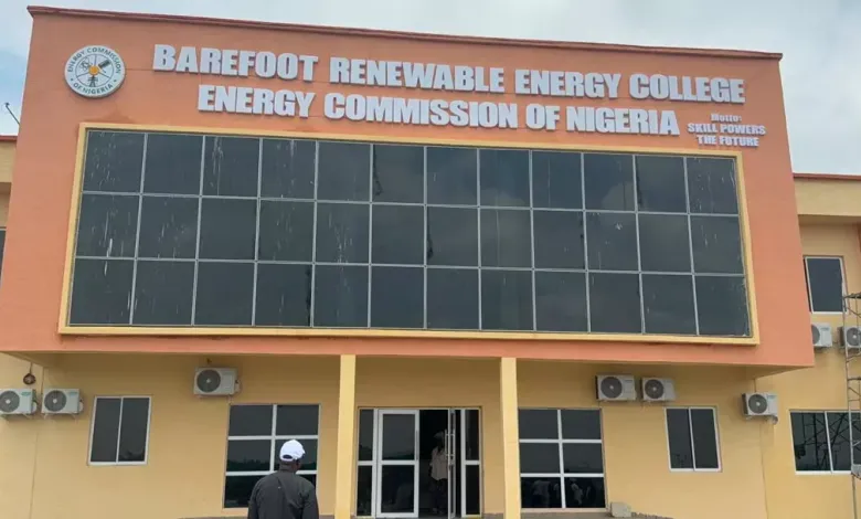 Barefoot renewable energy - The Times of Abuja Front view of Barefoot Renewable Energy College building with an orange facade and a large sign reading 'Barefoot Renewable Energy College – Energy Commission of Nigeria' above the glass facade.