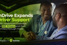 Handshake between a medical professional and a driver inside a car, promoting inDrive's driver support and healthcare coverage (partnership with Heala).