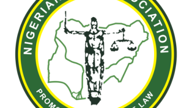Nigerian Bar Association logo with a central justice figure over a map, surrounded by a green-yellow ring and motto 'Promoting the Rule of Law'.